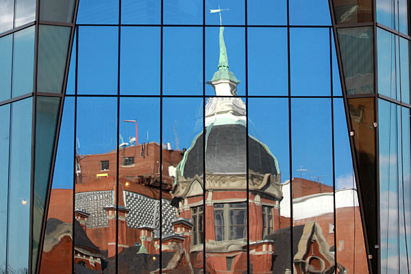The historic Wilmer dome is reflected in the new building’s windows.