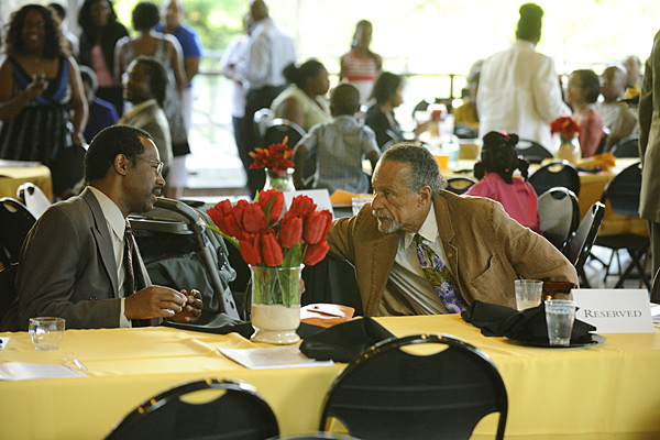 Honorees Ben Carson and James West share a personal moment during the Black Faculty and Staff Association dinner.