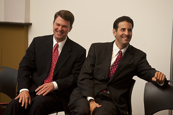 U.S. Office of Personnel Management Director John Berry and Rep. John Sarbanes react to a quip by Johns Hopkins President Ron Daniels.