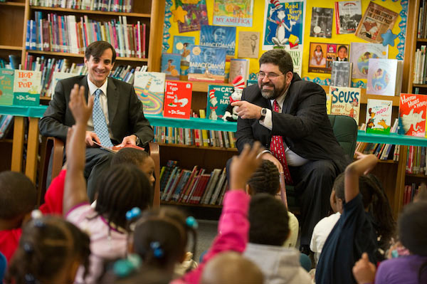 JHU President Ronald J. Daniels and Baltimore City Public Schools CEO Andrés A. Alonso read to students at Barclay Elementary/Middle School. (Photo: Will Kirk, homewoodphoto.jhu.edu