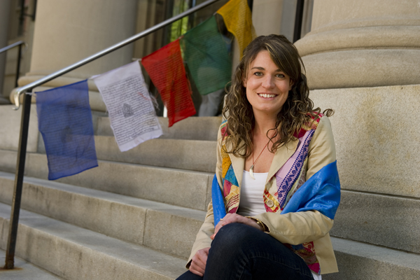 Back from Mongolia: Halshka Graczyk with souvenir flags and a prayer shawl. Photo: Will Kirk/Homewoodphoto.jhu.edu